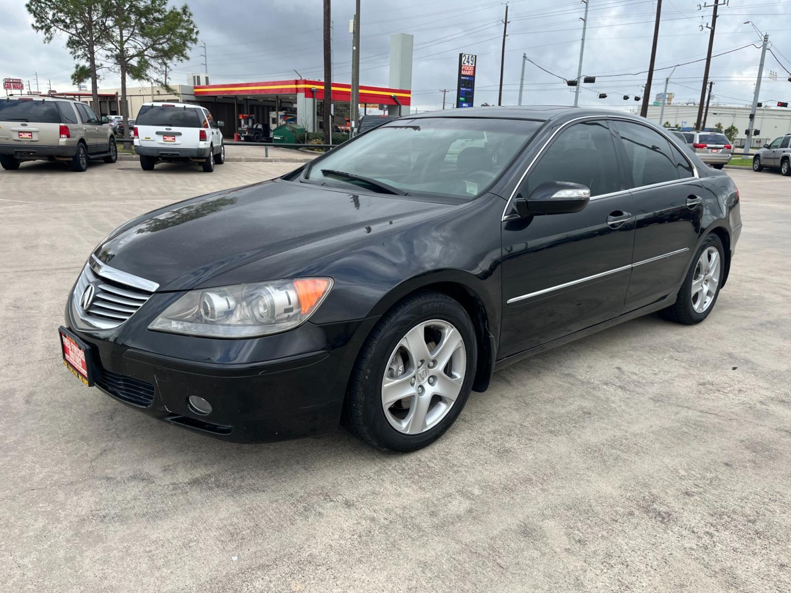 2005 Black /black Acura RL 3.5RL with Navigation System (JH4KB165X5C) with an 3.5L V6 SOHC 24V engine, 5-Speed Automatic Overdrive transmission, located at 14700 Tomball Parkway 249, Houston, TX, 77086, (281) 444-2200, 29.928619, -95.504074 - Photo #2